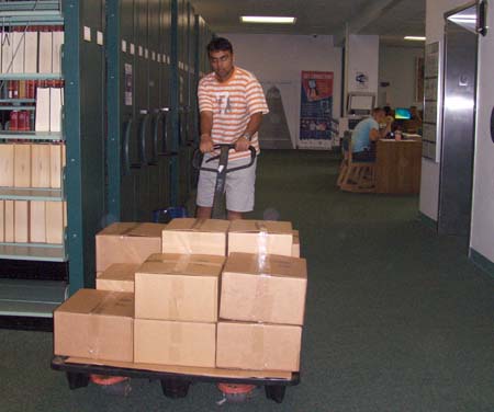 Transporting boxes through the Wimberly Library lobby