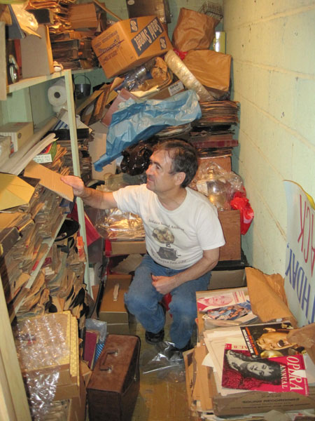 Ben Roth-Aroni looking for treasures in a hidden closet