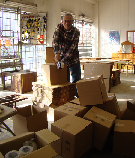 Nathan Tinanoff making boxes in furniture store.