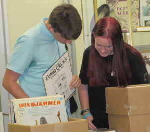 FAU students Allyson and Alexander browse through vinyl LPs.