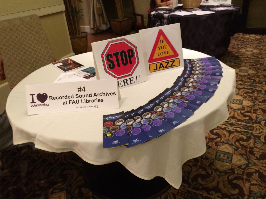 Image showing volunteers at a Recorded Sound Archives table or booth, likely from a volunteer recruitment event or fair at FAU Libraries