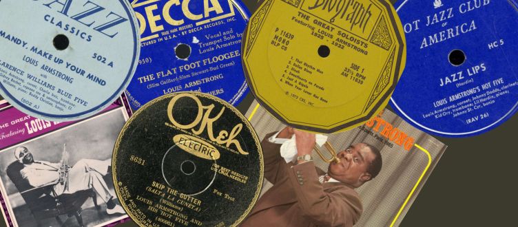 A selection of Louis Armstrong record labels and vinyl LP covers featuring his name and recordings.